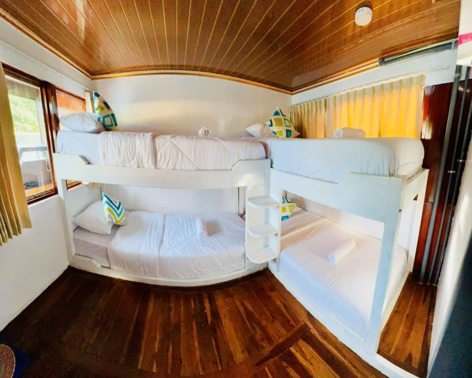 VIP cabin with ensuite bathroom and daybed aboard the Komodo liveaboard