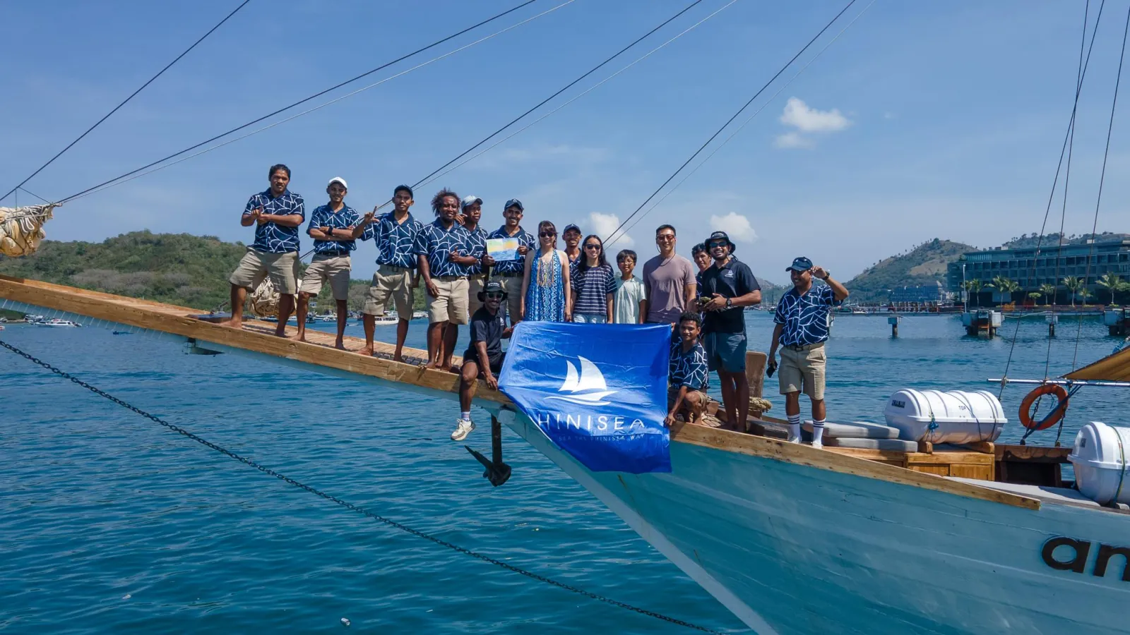 Crew and guests gathered on the bowsprit of the VIP Komodo liveaboard