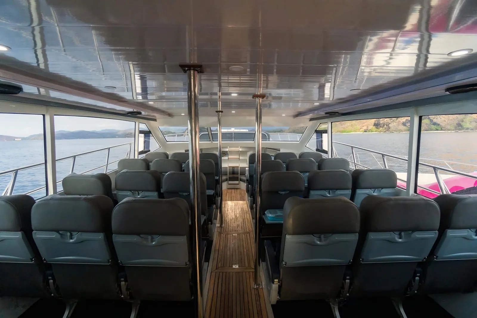 Air-conditioned passenger cabin of the Komodo day-trip speedboat
