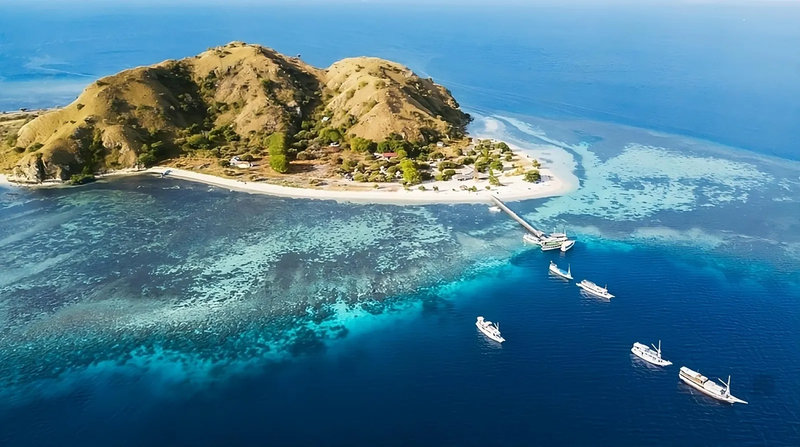 Aerial view of Kanawa Island and its fringing reef, Komodo National Park