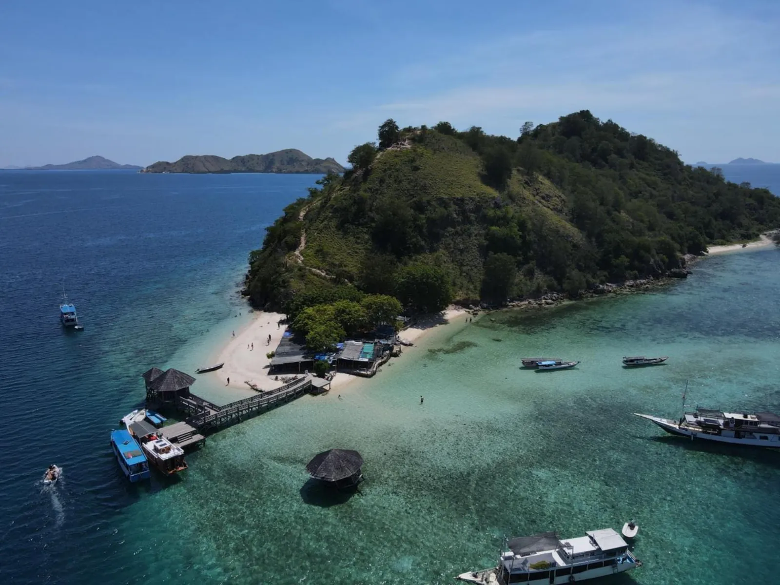 Aerial view of Kelor Island with day boats moored off its sandbar