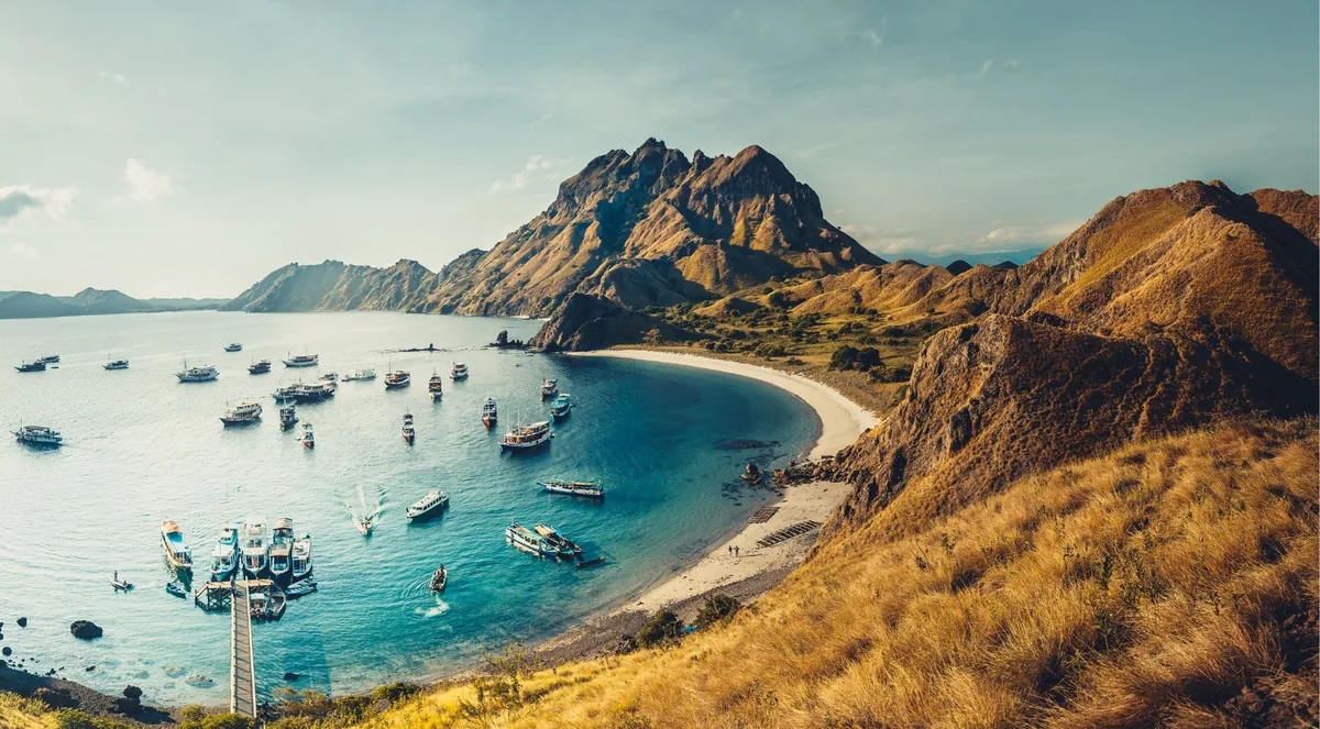 Liveaboard boats moored in the bay below Padar Island, Komodo National Park