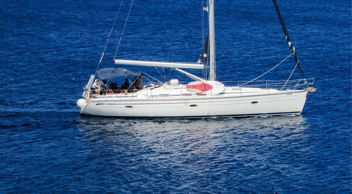 Private sailing yacht under way on deep blue water near Komodo National Park